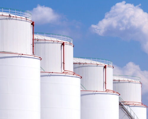 four big white tanks on blue skies four big white tanks on blue skies